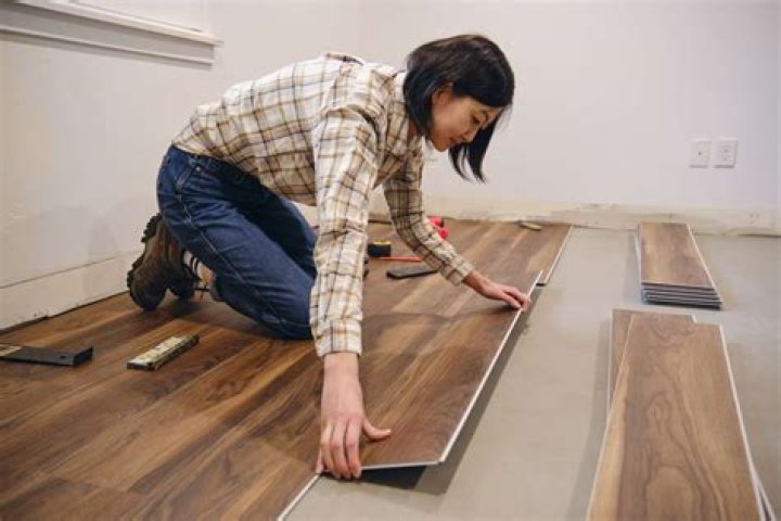 Can you use plastic under laminate flooring?